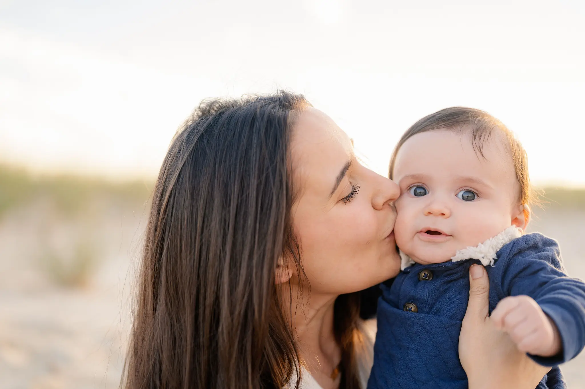 Mary kissing her son